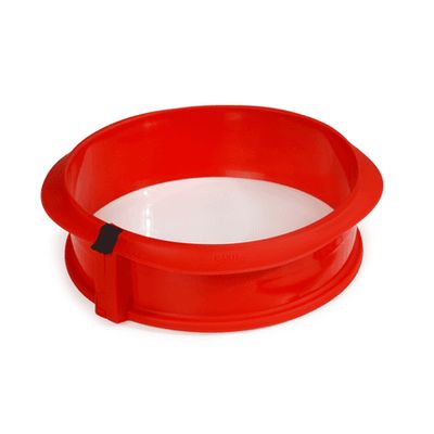 Springvorm uit silicone rood ø 23cm H 7cm met keramisch bord wit ø 23cm  Lékué